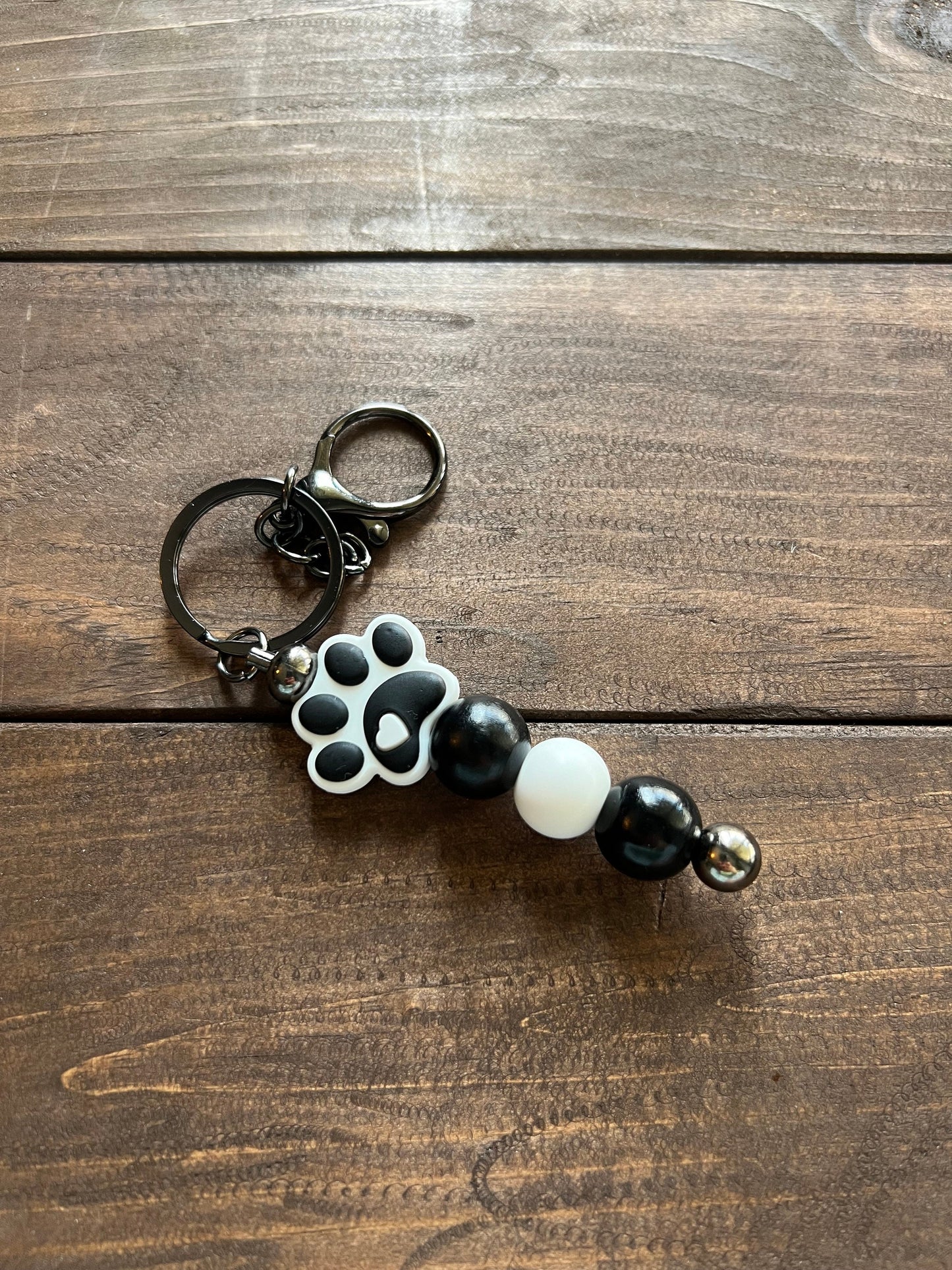 Beaded keychain with silicone paw print